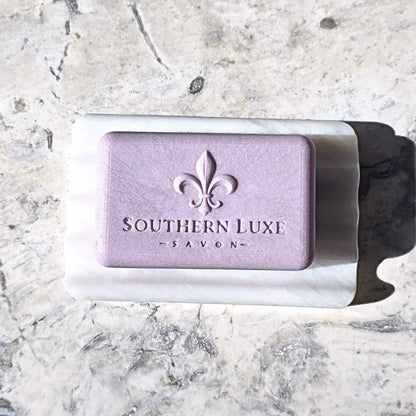 Bar of soap with 'Southern Luxe Savon' branding on a marble surface